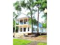 New construction shows two-story home with covered porch and balcony on a spacious lot and a corner street location at 239 Madison Dr., Georgetown, SC 29440