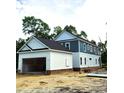 Two-story home with attached garage is under construction with a spacious side entry garage at 239 Madison Dr., Georgetown, SC 29440