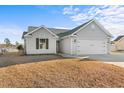 Nice gray house with a two-car garage and a spacious yard at 248 Hickory Springs Ct., Conway, SC 29527