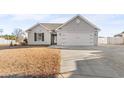 Gray house with a two-car garage and a large front yard at 248 Hickory Springs Ct., Conway, SC 29527