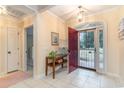 Bright entryway with red door, tile floors and a console table at 4712 Southern Trail, Myrtle Beach, SC 29579