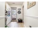 Bright condo entryway with tiled floor and view to exterior at 5010 Windsor Green Way # 301, Myrtle Beach, SC 29579
