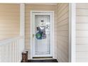 Condo front door with glass panel and decorative accents at 5010 Windsor Green Way # 301, Myrtle Beach, SC 29579