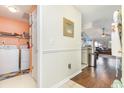 Condo laundry room with washer, dryer, and shelving at 5010 Windsor Green Way # 301, Myrtle Beach, SC 29579