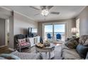 Living room with ocean view and comfy seating at 517 S Ocean Blvd. # 105, North Myrtle Beach, SC 29582