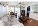 Living room features a sofa, recliner, and access to balcony at 517 White River Ct. # 22A, Myrtle Beach, SC 29579