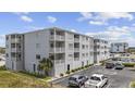Three-story building with parking and ocean views at 5709 N Ocean Blvd. N # 202, North Myrtle Beach, SC 29582