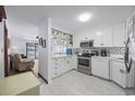 Bright kitchen with stainless steel appliances and white cabinets at 5709 N Ocean Blvd. N # 202, North Myrtle Beach, SC 29582