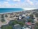 Aerial view showing house location near beach, highlighting proximity to ocean at 6001 South Kings Hwy., Myrtle Beach, SC 29575