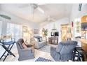 Bright and inviting living room with neutral walls, ceiling fans, and coastal decor at 6001-Z16 S Kings Hwy., Myrtle Beach, SC 29575