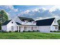 White farmhouse with a two car garage and landscaping at 2172 Pettus Way, Surfside Beach, SC 29575