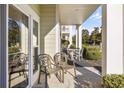 Covered patio with seating area and view of landscaping at 1001 World Tour Blvd. # 101A, Myrtle Beach, SC 29579