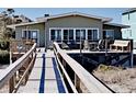 Beach house back deck with ocean views and walkway at 102 Seaview Loop, Pawleys Island, SC 29585