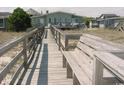 Wooden walkway to beach with benches at 102 Seaview Loop, Pawleys Island, SC 29585
