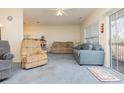 Living room with a view of kitchen, featuring two sofas and sliding glass door at 1058 Sea Mountain Hwy. # 1-303, North Myrtle Beach, SC 29582