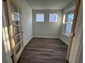 Bright and airy home office with hardwood floors and built-in shelving at 1257 Lady Bird Way, North Myrtle Beach, SC 29582