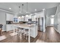 Bright kitchen featuring stainless steel appliances, island with seating, and modern finishes at 1405 Osprey Pointe Ln., North Myrtle Beach, SC 29582