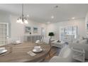 Living room with round dining table and comfy seating at 192 Sea Shell Dr. # 22, Murrells Inlet, SC 29576