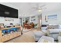 Open living room with light walls and comfortable seating at 2402 Hillside Dr. S, North Myrtle Beach, SC 29582