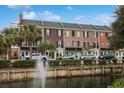 Townhouses by waterway with fountain and palm trees at 3526 Saint James Ave. # 3526, Myrtle Beach, SC 29577