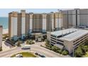 Aerial view of Beach Cove Resort, showing building and parking at 4800 S Ocean Blvd. # 312, North Myrtle Beach, SC 29582