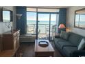 Ocean view living room with balcony access and comfy seating at 6804 N Ocean Blvd. # 1527, Myrtle Beach, SC 29572