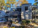 Gray building with a walkway and landscaping; shows building number at 88 Salt Marsh Circle # 22H, Pawleys Island, SC 29585