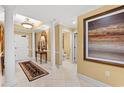 Beautiful hallway featuring tile flooring, columns, and decorative painting at 9547 Edgerton Dr. # 904, Myrtle Beach, SC 29572