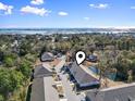 Aerial view showcasing a townhome's location near a pond at 97 Sea Shell Dr. # 33, Murrells Inlet, SC 29576