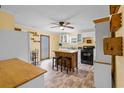 Kitchen with island, white cabinets, and wood countertops at 9719 E Highway 76, Nichols, SC 29581