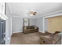 Cozy living room with brown couches and gray walls at 9719 E Highway 76, Nichols, SC 29581