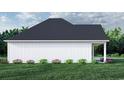 White farmhouse exterior side view showcasing the roofline and landscaping at 2180 Pettus Way, Surfside Beach, SC 29575