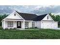 White farmhouse exterior with a black roof, two-car garage, and landscaping at Tbd Pettus Way, Surfside Beach, SC 29575