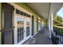 Front porch with double doors and dark shutters at 1204 Wading Heron Rd., North Myrtle Beach, SC 29582