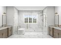 Bright bathroom featuring a seamless glass shower, soaking tub, dual vanities, and refined marble accents at 1526 Bellini Ct., Myrtle Beach, SC 29579