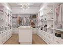 Spacious walk-in closet with custom shelving, drawers, and ample storage space for clothes and accessories at 1526 Bellini Ct., Myrtle Beach, SC 29579