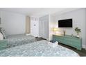 Two twin beds, dresser, and ocean view from the bedroom at 210 75Th Ave N # 4011, Myrtle Beach, SC 29572