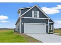Gray house with white garage door, showcasing the side profile at 216 William Nobles Rd., Aynor, SC 29511