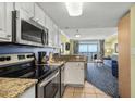 Kitchen with granite countertops and stainless steel appliances at 2201 Ocean Blvd. S # 1809, Myrtle Beach, SC 29577