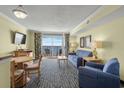 Living room with ocean view, sofa, chairs and dining table at 2201 Ocean Blvd. S # 1809, Myrtle Beach, SC 29577