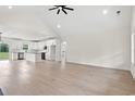Open living space with hardwood floors, high ceilings, and a kitchen view at 224 William Nobles Rd., Aynor, SC 29511
