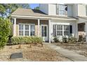 Brick and siding townhouse exterior with walkway and shrubs at 321 Seabert Rd. # 321, Myrtle Beach, SC 29579