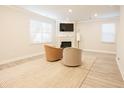 Finished basement with fireplace and two armchairs at 3339 Moss Bridge Ln., Myrtle Beach, SC 29579