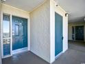 Building hallway with teal doors and carpet at 3601 S Ocean Blvd. # 7-E, North Myrtle Beach, SC 29582