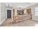 Kitchen with an island, wood cabinets, and granite countertops at 3923 Gladiola Ct. # 301, Myrtle Beach, SC 29588