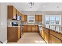 Kitchen featuring stainless steel appliances, granite counters, light oak cabinetry, and hardwood floors at 3923 Gladiola Ct. # 301, Myrtle Beach, SC 29588