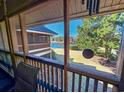 Screened-in patio featuring serene views of the landscaped garden and lake at 410 Melrose Pl. # 219, Myrtle Beach, SC 29572