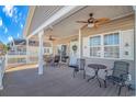Deck with patio furniture and ceiling fan, offering outdoor relaxation at 6001-1810 S Kings Hwy., Myrtle Beach, SC 29575