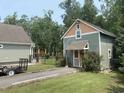 Cozy outbuilding featuring matching exterior with the main home, adding charm to the property at 640 Fox Hollow Rd., Murrells Inlet, SC 29576