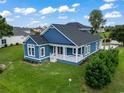 Ranch style blue home with white trim and a spacious front yard at 1103 Bluffton Ct., Myrtle Beach, SC 29579